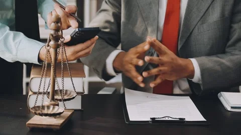 Lawyer write drafts a legal document at a desk with stationery and a laptop.. Stock Footage 304847003