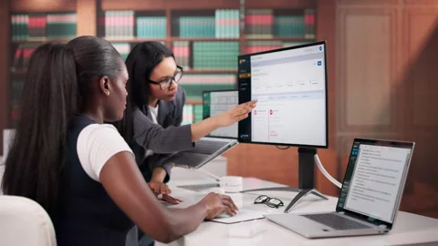 Lawyers Reviewing Documents On Computer Stock Footage 334924096