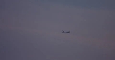 LAX Jet in Sky at Sunset. Stock Footage 66653464