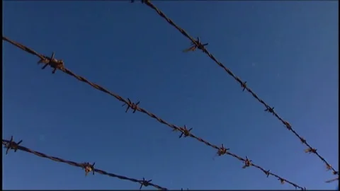 LAX plane lands over barbed wire V1-0026 Stock Footage 76197722