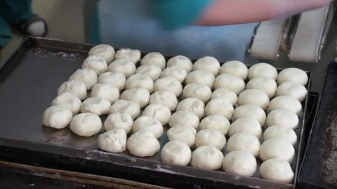 Lay the dough lumps on the trays Stock Footage 81285457