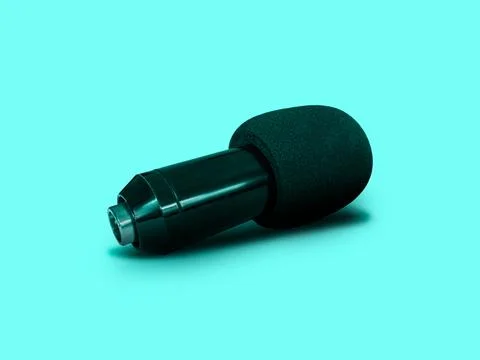 Lay Down Black Condenser Microphone with Foam Windshield isolated on Turquo.. Stock Photos
