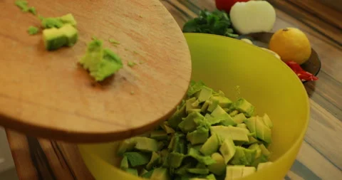Lay down  sliced ​​avocado in a salad bowl Video stock 244422701