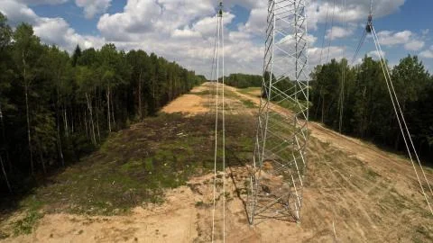 Lay electricity in settlements. Long distance electricity transmission. Stock Photos