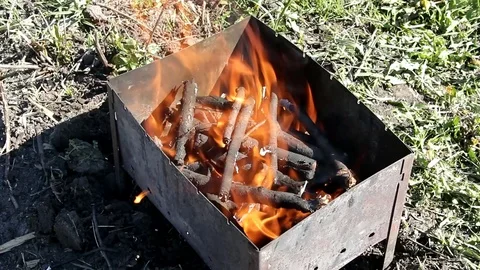 To lay firewood in the fire in the grill Stock Footage 89668140
