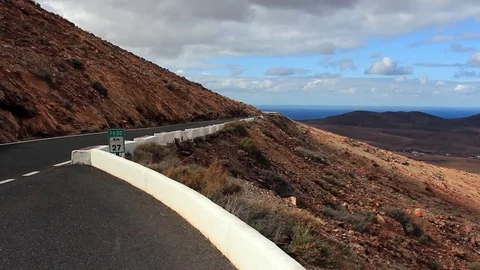 Lay-by of mountain road overlooking valley Stock Footage 84930315
