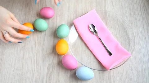 Lay out beautifully colored Easter eggs on the table. Stock Footage 61568360