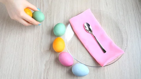 Lay out beautifully colored Easter eggs on the table. Stock Footage 61568699
