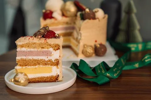 Layer cake with chocolate decorations in the shape of Christmas tree decorations Stock Photos