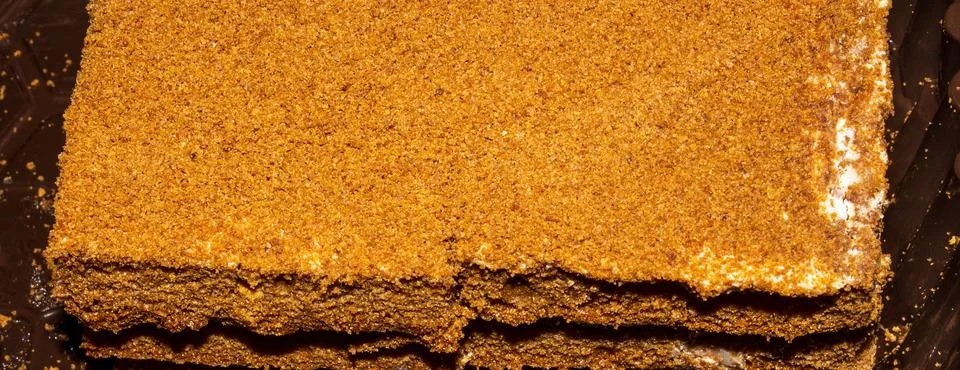 Layer cake honey cake with a layer of cream.Honey cake background. Stock Photos