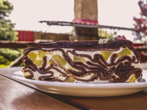 Layer cake lies on a plate Stock Photos