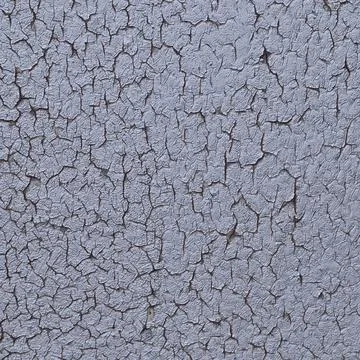A layer of dry and cracked silver paint. Stock Photos