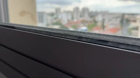 A layer of dust on a modern plastic window Stock Footage 340017068