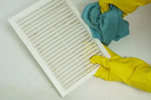 A layer of dust on the ventilation grate.Dust is wiped with a cloth Stock Photos