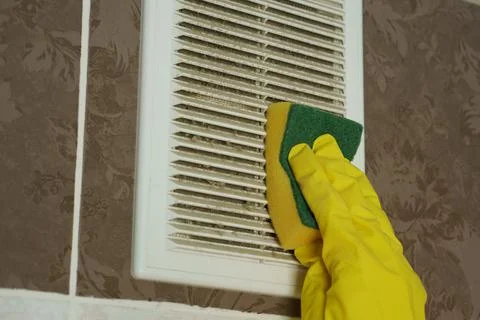 A layer of dust on the ventilation grate.Dust is wiped with a sponge Stock Photos