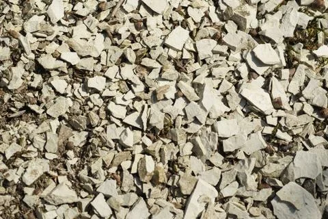 A layer of grey limestone rubble for the background. Stone texture Stock Photos