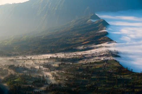 Layer of Mist Over the Mountains and in a village Stock Photos