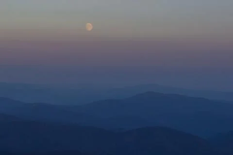 Layer of mountains and mist during sunset Stock Photos