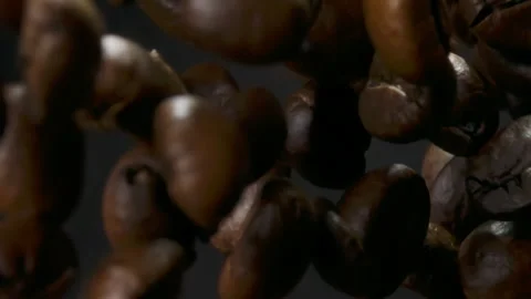 Layer of roasted coffee beans rising and falling in slow motion Stock Footage 316071090