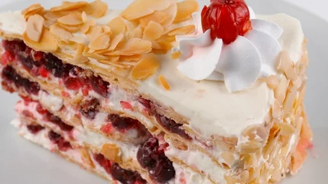 Layered Cherry cake, stuffed with cherries and cream sliced almonds Vídeos de archivo 87173758