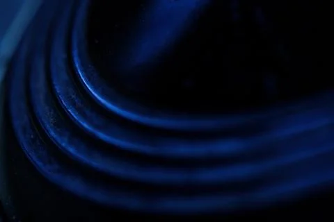 Layered circle texture background with blue light Foto stock