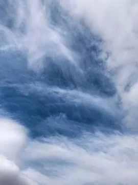 Layered Cirrus Clouds Creating Abstract Sky Pattern Stock Photos