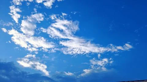 Layered Clouds in Bright Blue Sky Background Stock Photos