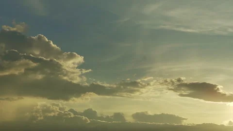 Layered clouds under golden sky timelapse Stockbeeldmateriaal 337639653