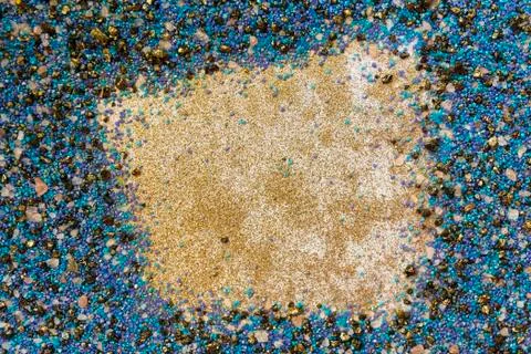Layered colorful sand pattern. Marble style background. Blue and gold powder Stock Photos