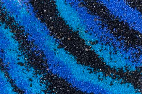 Layered colorful sand pattern. Marble style background. Blue and black powder Stock Photos