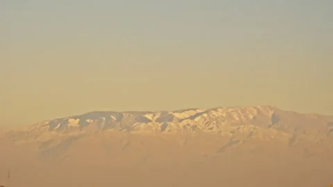 Layered Danxia Hills with Distant Snowy Mountains B-Roll 스톡 동영상 325867346