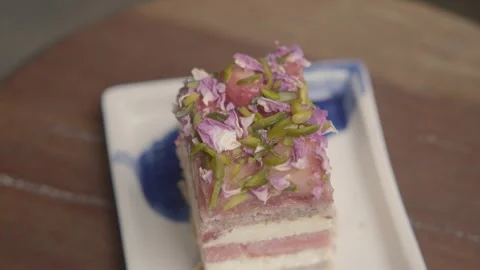 Layered Dessert Slice with Colorful Toppings Served Indoors in Sydney, Australia Stock Footage 345654950