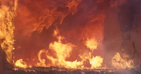 Layered fire seen through the window of a structure Stock Footage 59223415