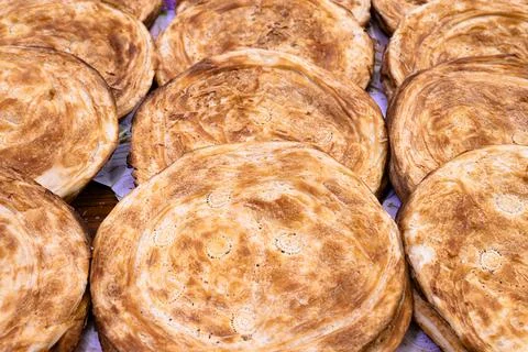 Layered flatbreads displayed at a traditional bazaar in Bukhara, Uzbekistan.. Stock-Fotos