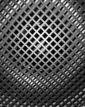 A layered metallic texture, featuring a dark, diagonally-oriented grid 写真素材