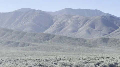 Layered Mountain Ridges Across Open Sagebrush Desert Stock Footage 331274628