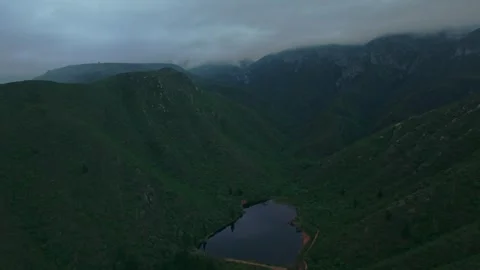 Layered mountain ridges fading into mist, moody cinematic aerial Stock Footage 342336022