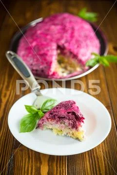 Layered pastry salad with herring and beetroot Stock Photos