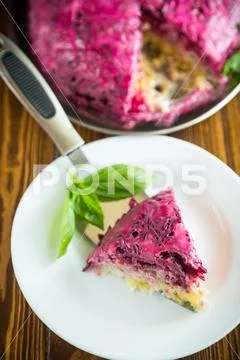 Layered pastry salad with herring and beetroot Stock Photos