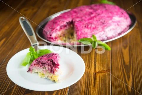 Layered pastry salad with herring and beetroot Stock Photos