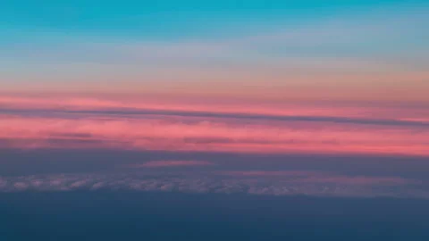 Layered Pink and Lavender Sky Bands Above Distant Clouds Stock Footage 337902260