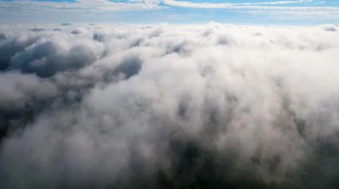 Layered rain clouds on the sky background. Stock Photos