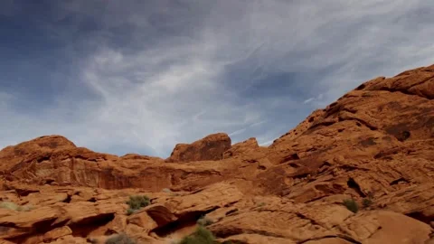 Layered red rock mountains under a bright sunny sky Stock Footage 329559840