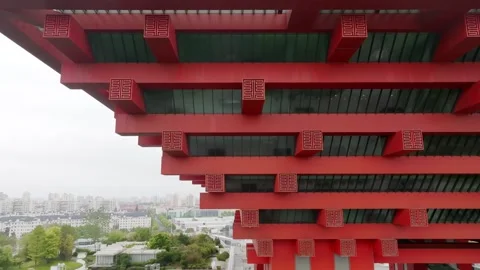 Layered red structural beams across a pavilion facade in Shanghai Stock Footage 346606956