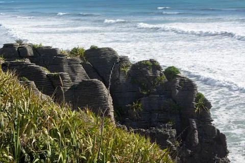 Layered Rock Formations by the Ocean Stock Photos