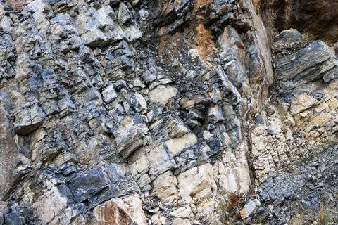 Layered rock texture. Mountain pattern background. Stock Photos