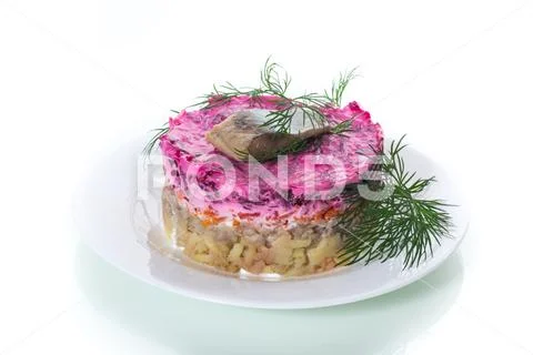 Layered salad of boiled vegetables with beets and herring Stock Photos