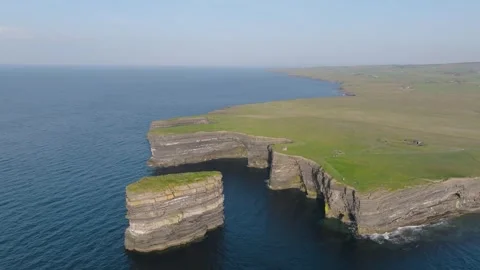 Layered Sea Stack Dun Briste Beside Flat Grass Headland. R R Mayo Ireland Stock Footage 342056123