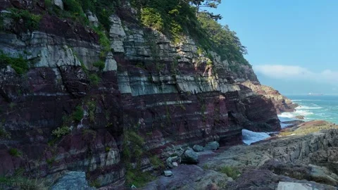 Layered sedimentary rock cliffs at amnan park in busan 스톡 동영상 341908750