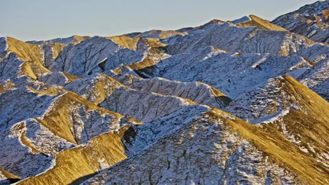 Layered Snow-Covered Danxia Hills Sunset B-Roll 스톡 동영상 325859272